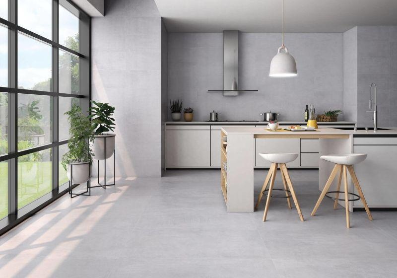 Large-format grey porcelain tiles in a contemporary kitchen.